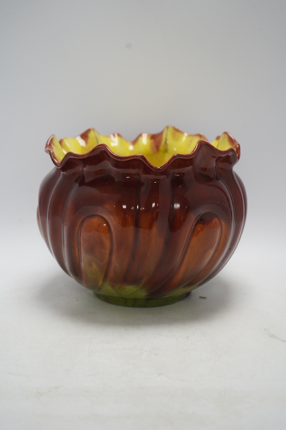 An early 20th century Bretby majolica jardiniere, 19cm. Condition - fair to good